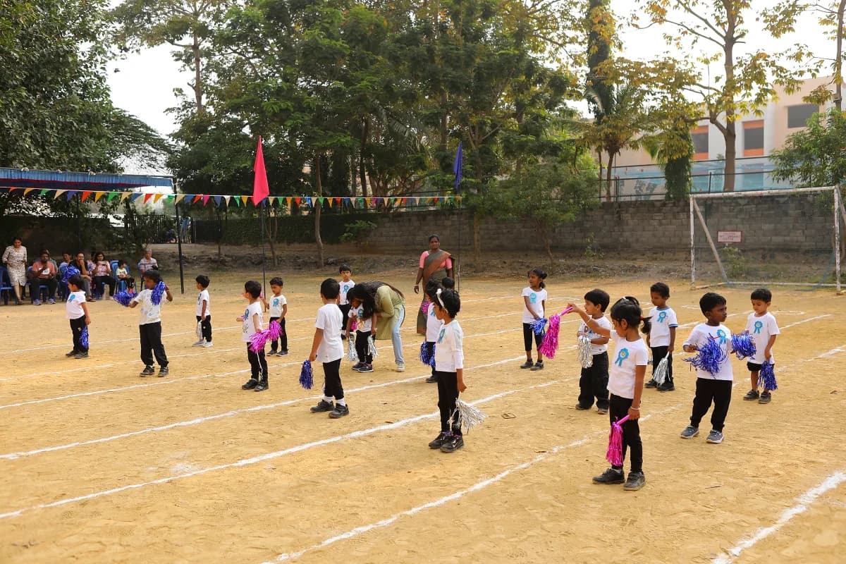 Young students sprinting enthusiastically during annual sports day running race